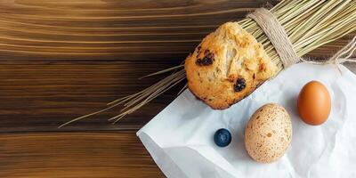 Easter celebration with traditional bread, decorative branches, and colorful eggs on a festive table photo
