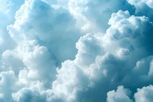 Dense, fluffy clouds fill the frame, showcasing variations in light and shadow creating a textured, ethereal sky. photo