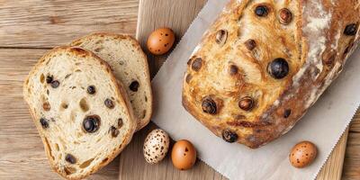 Easter bread with quail eggs and catkins arranged beautifully on a rustic wooden table photo