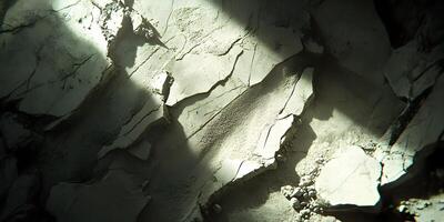 Cracked, dry, textured surface with light beam. photo