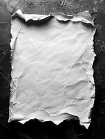 Crumpled white paper on dark textured background photo