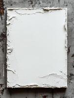 Blank white textured canvas on grunge wall, art background photo
