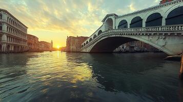 Venice sunrise over Rialto Bridge and Grand Canal photo
