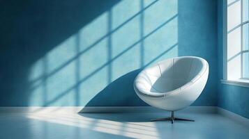 White chair by window in blue room with sunlight shadows photo