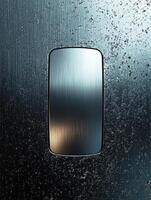 Silver rectangle on textured metal background for use in design or display photo