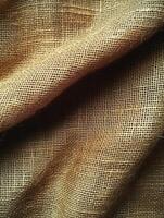 Textured burlap surface folds with shadows for background, backdrop, and presentations photo