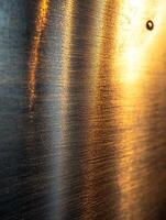 Metal surface with reflective light, abstract, for texture or background, closeup photo