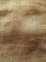 Woven cloth background texture, dark center fading to light edges. Uses include mock-ups photo
