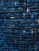 Close-up of a woven blue fabric texture and detail is visible photo