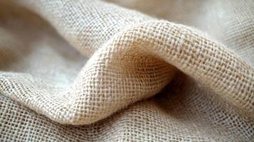 Close-up of light brown fabric texture, folded, for background or designs photo