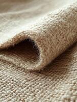 Folded beige textile background for fabrics photo