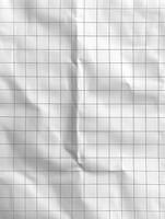 Crinkled white graph paper sheet, for background texture and design photo