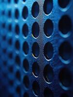 Metal sheet with holes, close up view, angled for tech backgrounds photo