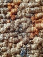 Woven tan and orange textile, close-up, background texture. Use textile design photo