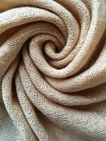 Swirl fabric close up, tan, textured, used for clothing, crafts photo