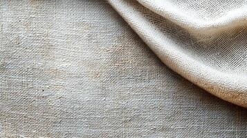 Beige cloth draped, textured surface, neutral background for textile uses photo