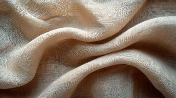 Beige, woven cloth in folds, background, for textile or fabric use photo