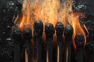 Burning matches lined up on dark surface. Flame background. Used for social content photo
