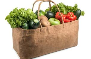 A burlap bag filled with fresh produce and vegetables photo