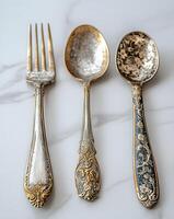 Antique Silverware Set Featuring Fork And Spoons photo