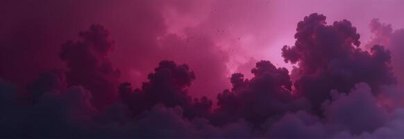 Dramatic pink and purple clouds filling the sky at sunset photo