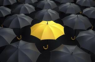 Yellow umbrella standing out from crowd of black umbrellas representing uniqueness and individuality photo