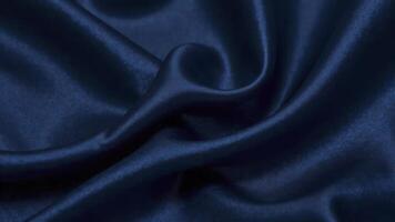 Smooth elegant blue satin fabric forming an abstract background photo