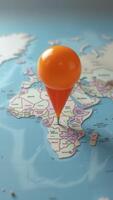 Orange push pin pointing gabon on a world map photo