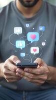 Smartphone with social media icons and likes. Man hand using smartphone typing live chat chatting on application communication digital web and social network concept. Application chat box photo