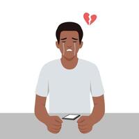 Sad man sits at a table, looking at his phone, expressing deep sorrow and heartbreak. vector