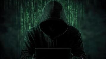 Hooded hacker typing on privacy in shadowy workspace, representing cybersecurity threat and digital laptop breach cyber risk background photo