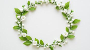 the background with a green leafy wreath. lily of valley White photo