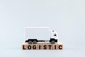 White toy truck on blocks with the text LOGISTIC. photo