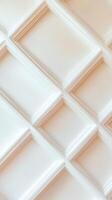 White rhombus geometric pattern decorating a wall, adding a touch of elegance and sophistication interior to design. Vertical format abstract photo