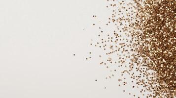 Shimmering golden glitter dusting white background, evoking celebratory glamour Copy space for text photo