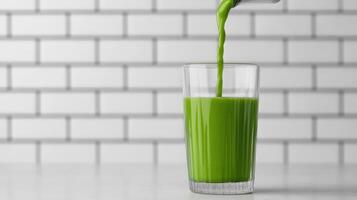 Green smoothie streaming into glass, white tiled surface showcasing nutritious eating detox healthy for preparation beverage menu, recipe and food blog copy space photo