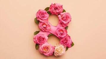A beautiful floral arrangement designed in the shape of the number eight, featuring delicate pink and ivory roses set against a soft, light background photo