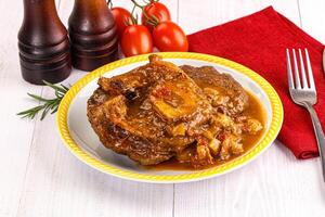 A plate of food with a fork and knife photo