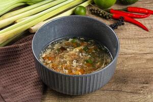 A bowl of soup with vegetables and other ingredients photo