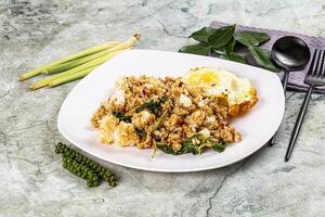 A plate of food with a fork and spoon on a table photo