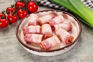 Bacon wrapped in bacon on a plate photo