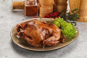Chicken on a plate with spices and herbs photo