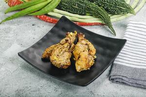 A plate with some vegetables and some chicken photo