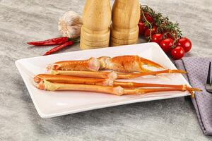 A plate with two cooked crabs on it photo