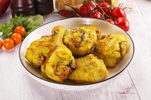 A bowl of chicken on a table photo
