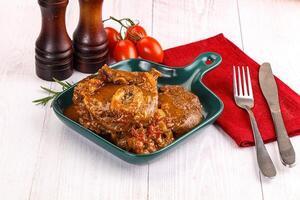 A plate of food with a fork and knife photo