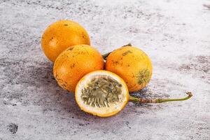 Passion fruit on a grey background photo