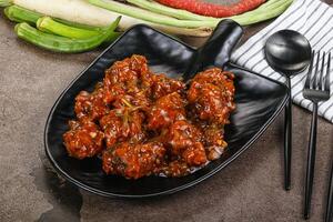 A black bowl with some food on it photo