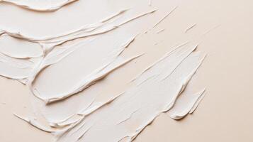 Creamy texture spread over smooth surface showcasing artistic application of skincare product in natural light photo