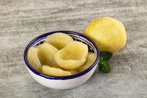 A bowl of lemons and a lemon slice photo
